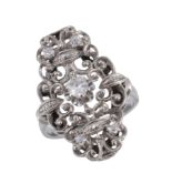 A diamond ring, the central old brilliant cut diamond claw set within a pierced scroll surround set