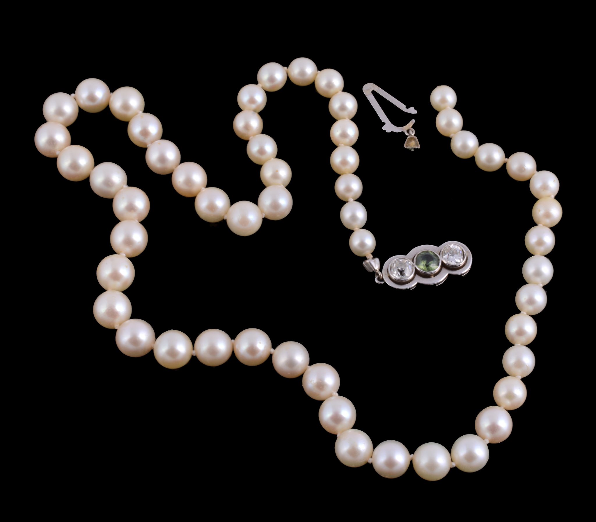 A cultured pearl necklace, composed of graduating circular shaped cultured pearls, on a knotted