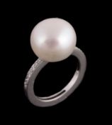 A cultured pearl and diamond ring, the 12.8mm cultured pearl between brilliant cut diamond set