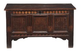 A Charles II panelled oak and parquetry inlaid chest, circa 1660  A Charles II panelled oak and