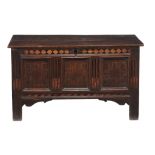 A Charles II panelled oak and parquetry inlaid chest, circa 1660  A Charles II panelled oak and