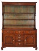 A George III oak dresser , circa 1760, probably North Caernarfonshire  A George III oak dresser  ,