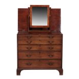 A George III mahogany dressing chest , circa 1780, of campaign type  A George III mahogany