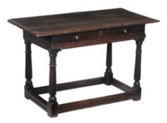 A Charles II oak side table , circa 1660, the rectangular top above frieze...  A Charles II oak side