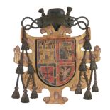 A Spanish carved, painted and parcel giltwood armorial panel, 19th century A Spanish carved, painted