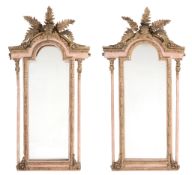 A pair of Continental giltwood and painted wall mirrors  A pair of Continental giltwood and