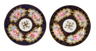 A pair of Coalport bone china blue and ivory-ground plates, circa 1820  A pair of Coalport bone