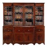 A Regency mahogany breakfront library bookcase, circa 1815, moulded cornice  A Regency mahogany