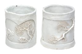 Two Duhua 'Blanc de Chine' brush pots, with incised and carved decoration  Two Duhua 'Blanc de
