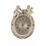 A Meissen porcelain oval desk timepiece frame and timepiece, late 19th century  A Meissen