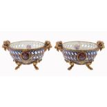 A pair of Meissen two-handled and pierced baskets, circa 1800, with ram  A pair of Meissen (