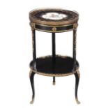 circa 1860, gilt metal mounted throughout, the circular porcelain inset top decorated in
