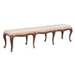 A carved beech and upholstered stool , in mid 18th century Continental style  A carved beech and