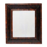 A Queen Anne oyster laburnum wall mirror, circa 1710  A Queen Anne oyster laburnum wall mirror,