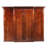 A Victorian mahogany breakfront compactum wardrobe , circa 1870  A Victorian mahogany breakfront