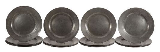 A set of twenty-one English pewter plates, probably early 18th century  A set of twenty-one