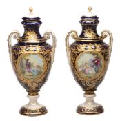 A pair of French pottery Sevres-style blue-ground and gilt pedestal vases...  A pair of French