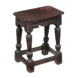 A Charles I oak joint stool , 17th century and later, the rectangular top with moulded edge above