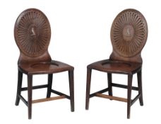 A matched pair Regency mahogany hall chairs , circa 1815  A matched pair Regency mahogany hall