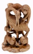 An Ivory Okimono of Macaques , the six apes depicted appear to be attacking...  An Ivory Okimono
