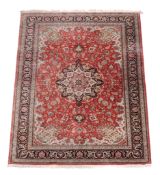 A Persian silk carpet, approximately 310 x 199cm  A Persian silk carpet,   approximately 310 x 199cm