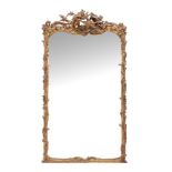 A Continental giltwood and composition wall mirror , 19th century  A Continental giltwood and