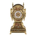 A French Boulle mantel clock in 'Tete de Poupe' style , Bon à Paris  A French Boulle mantel clock in