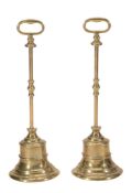 A pair of brass door porters, 19th century  A pair of brass door porters,   19th century ,   each