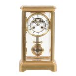 A French brass four-glass mantel clock, L  A French brass four-glass mantel clock, L. Marti et