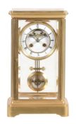 A French brass four-glass mantel clock, L  A French brass four-glass mantel clock, L. Marti et