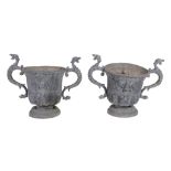 A pair of lead twin handled garden urns, early 20th century  A pair of lead twin handled garden