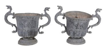 A pair of lead twin handled garden urns, early 20th century  A pair of lead twin handled garden