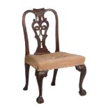 A George II mahogany side chair, circa 1750, the carved toprail above a decorative pierced splat,