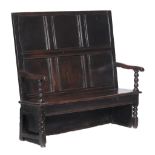 An oak settle, late 17th century and later  An oak settle,   late 17th century and later, with