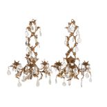 A pair of Continental gilt metal and cut glass hung three light wall appliques  A pair of