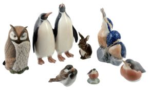 Seven Royal Copenhagen porcelain animals: two bird groups, an owl, a hare  Seven Royal Copenhagen