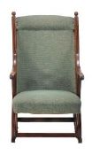 circa 1890, in the Arts & Crafts taste, the the rounded back and overstuffed seat within a fluted