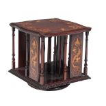 An Arts and Crafts mahogany and inlaid table top revolving bookcase  An Arts and Crafts mahogany and