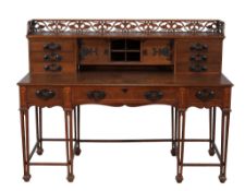 An Arts and Crafts oak and inlaid desk by Holland and Sons  An Arts and Crafts oak and inlaid desk
