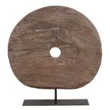 A Burmese disc, on a metal stand, 76cm high, 72cm wide  A Burmese disc,   on a metal stand, 76cm