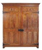 A Gothic Revival panelled oak cupboard, circa 1900  A Gothic Revival panelled oak cupboard,