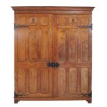 A Gothic Revival panelled oak cupboard, circa 1900  A Gothic Revival panelled oak cupboard,