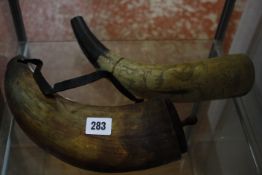 Two North European incised cow powder horns.