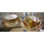 A Royal Worcester cabinet cup and saucer signed S. Roberts and a Royal Worcester cabinet and