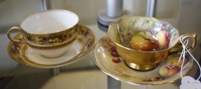 A Royal Worcester cabinet cup and saucer signed S. Roberts and a Royal Worcester cabinet and