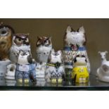 A Lladro owl, marked to base, a quantity of owl figurines, a Royal Copenhagen model of a cat and