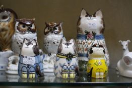 A Lladro owl, marked to base, a quantity of owl figurines, a Royal Copenhagen model of a cat and