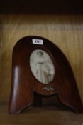 [Militaria] - A Great War RAF Photograph Frame, worked from the tip of a mahogany propeller, with