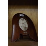 [Militaria] - A Great War RAF Photograph Frame, worked from the tip of a mahogany propeller, with