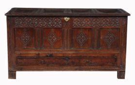 A Charles II oak mule chest, circa 1680, the quadruple panelled lid opening to large compartment,
